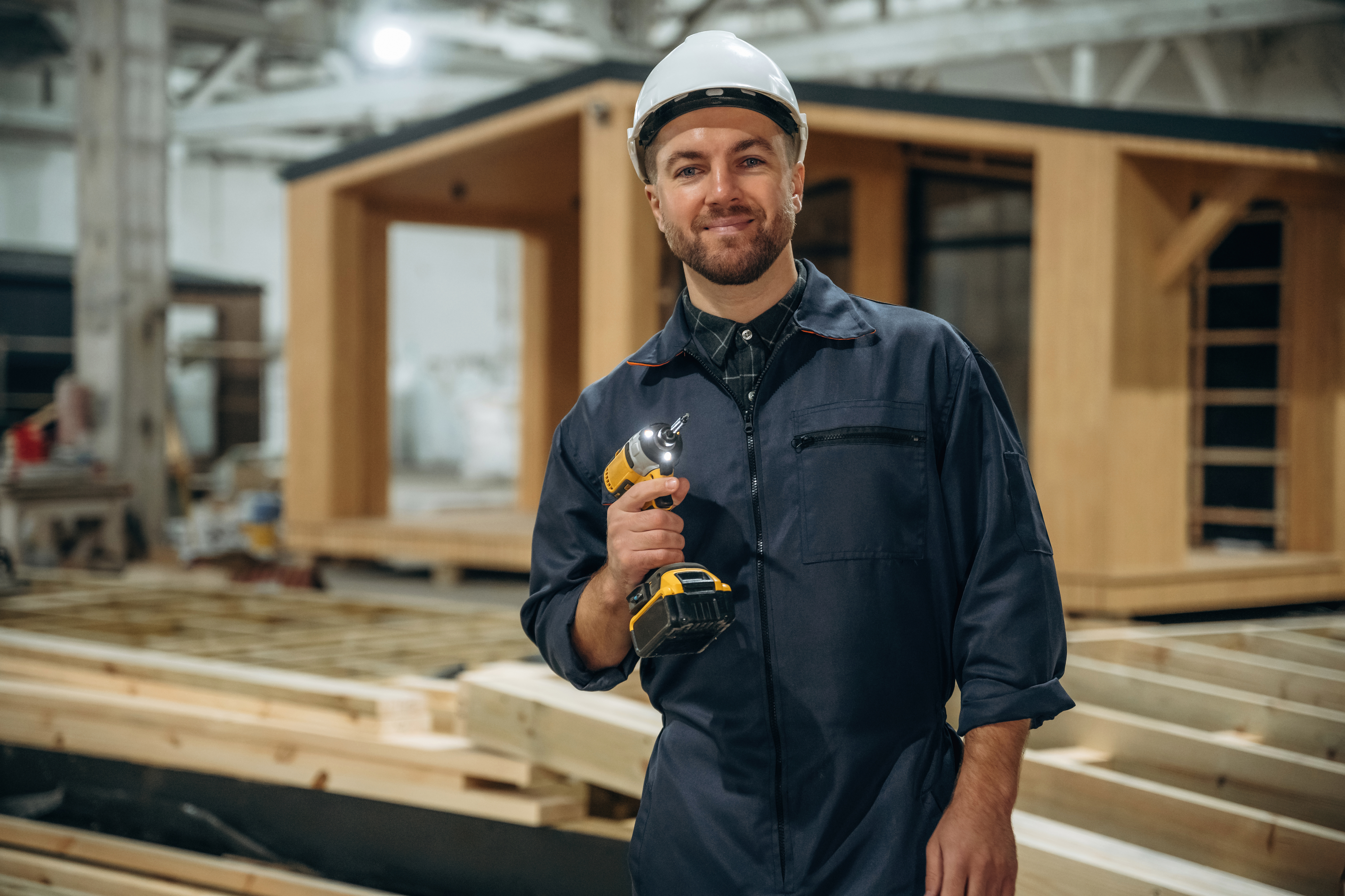 small-drill-in-hands-male-buil